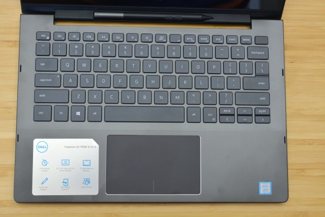 The Dell Inspiron 13 7000 Black Edition sitting on a wooden table.