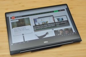 The Dell Inspiron 13 7000 Black Edition sitting on a wooden table.