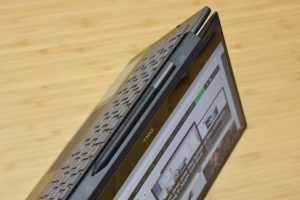 The Dell Inspiron 13 7000 Black Edition sitting on a wooden table.