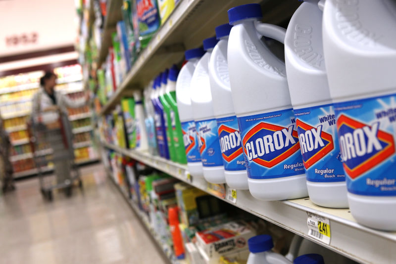 Bottles of Clorox bleach sit on a shelf at a grocery store.