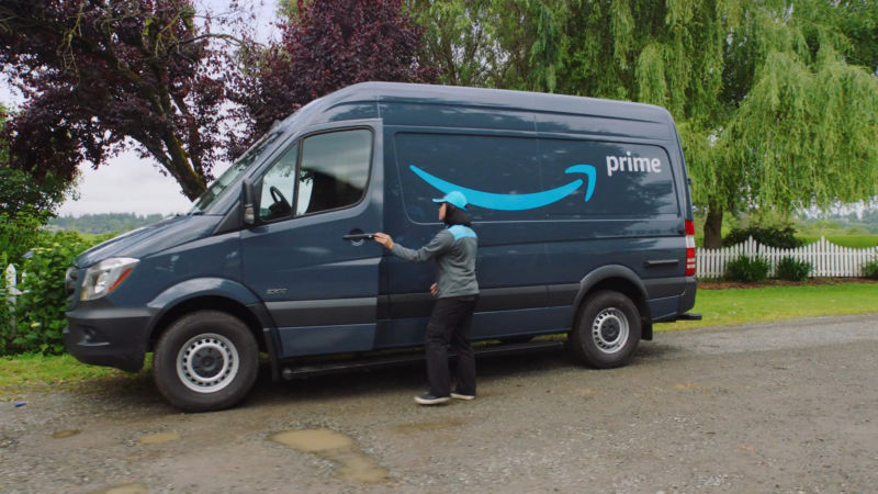 An Amazon Prime brand van and driver.