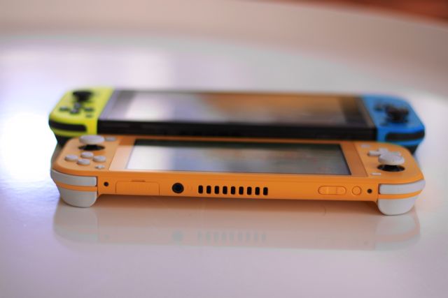 Nintendo's Switch Lite console (front) compared to the standard Switch model.