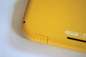 Promotional images of handheld gaming console.