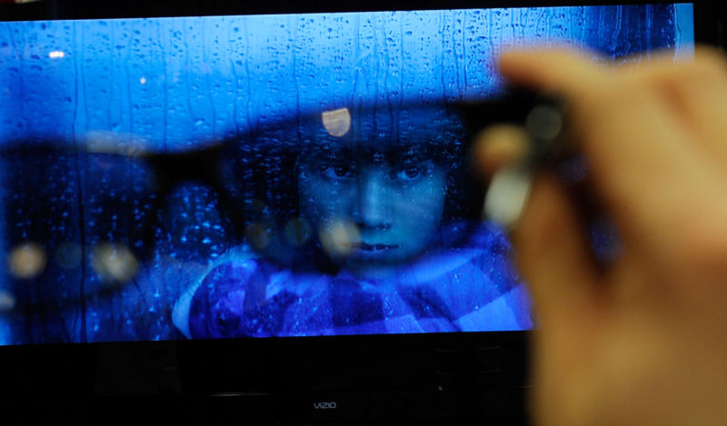 A photograph of a TV as taken through a pair of eyeglasses.