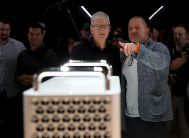 Apple CEO Tim Cook and chief design officer Jony Ive look at the new Mac Pro on June 3, 2019.