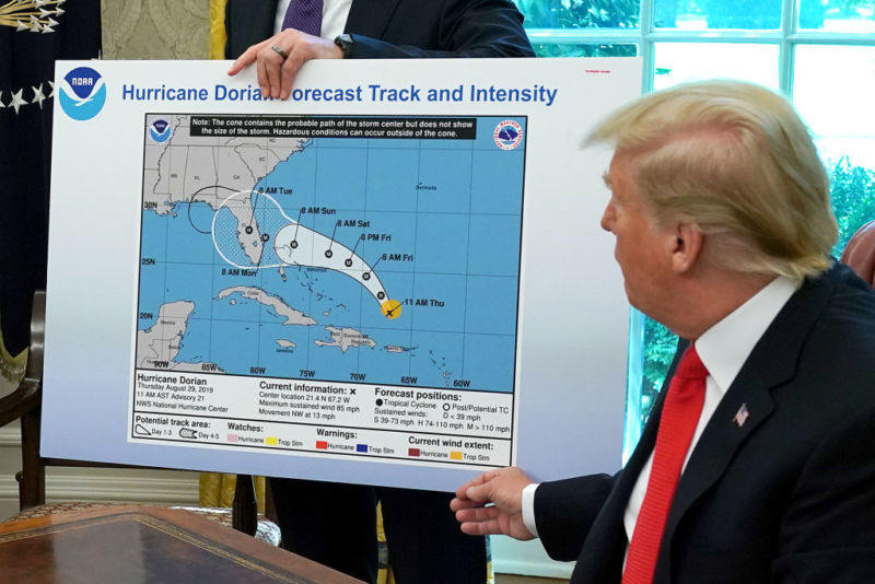 US President Donald Trump references a map held by acting Homeland Security Secretary Kevin McAleenan on Wednesday.