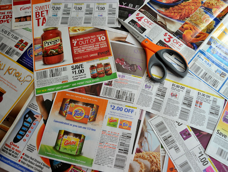 Coupons from the advertising section of a Sunday newspaper 