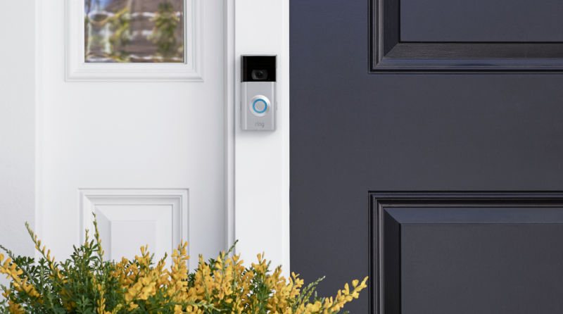 A Ring video doorbell mounted on a home.