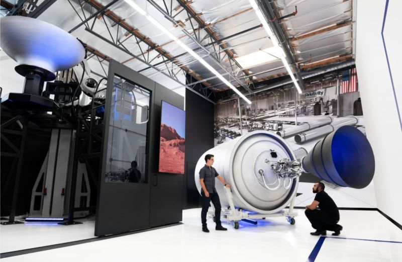 Relativity co-founders Tim Ellis, left, and Jordan Noone pose with a 3D printed second stage of the Terran 1 rocket.