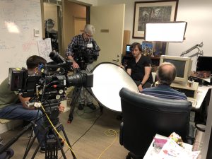 Image of filming Sid Meier at computer