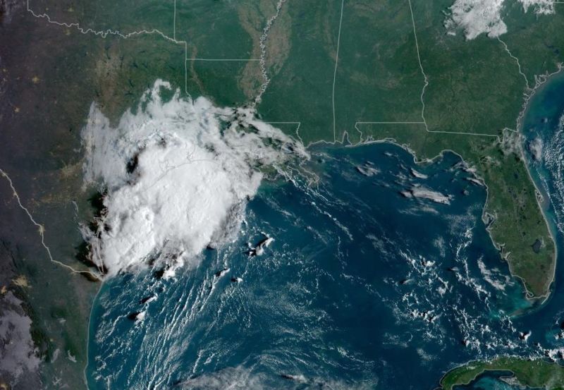A Tuesday morning satellite image shows a broad tropical system moving toward Texas.
