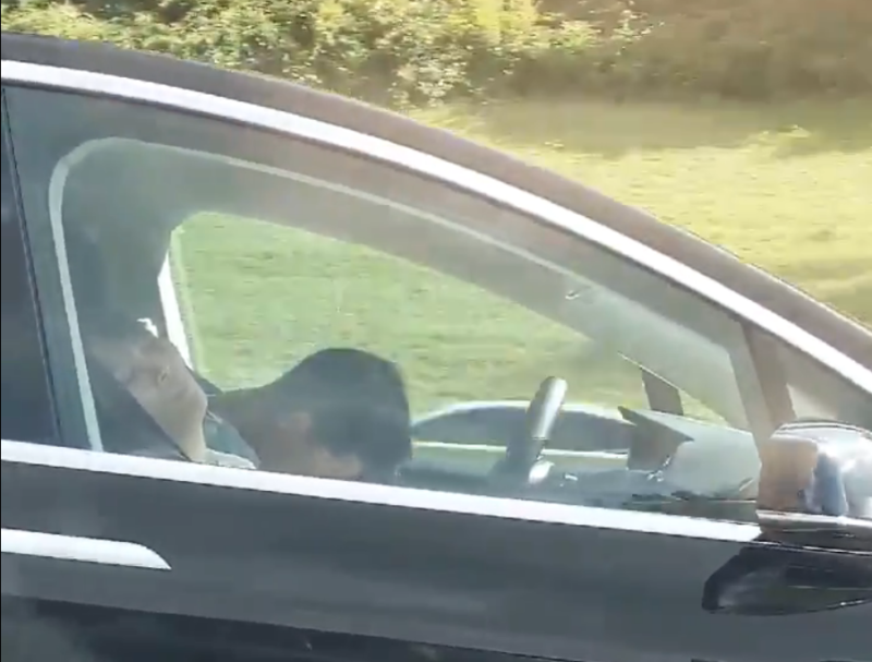 A driver and passenger apparently asleep in a Tesla in Massachusetts on Sunday.