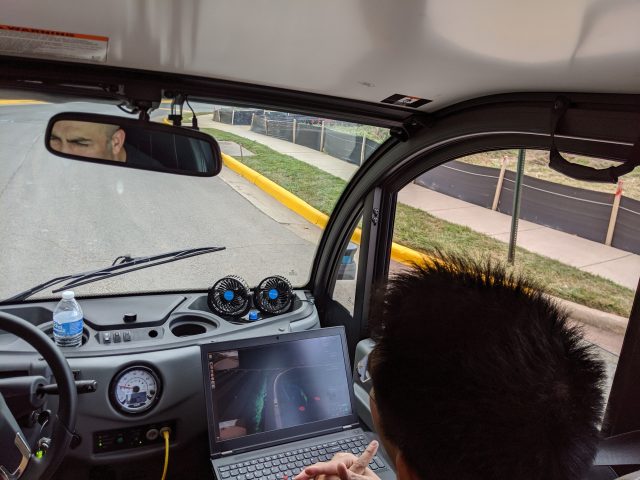 An Optimus Ride employee monitors the vehicle's progress.