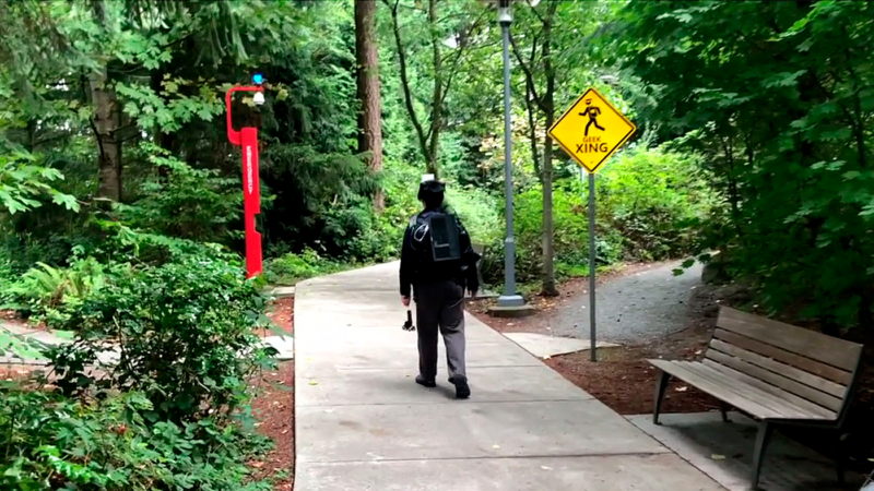 A user traverses a park while wearing a DreamWalker kit.