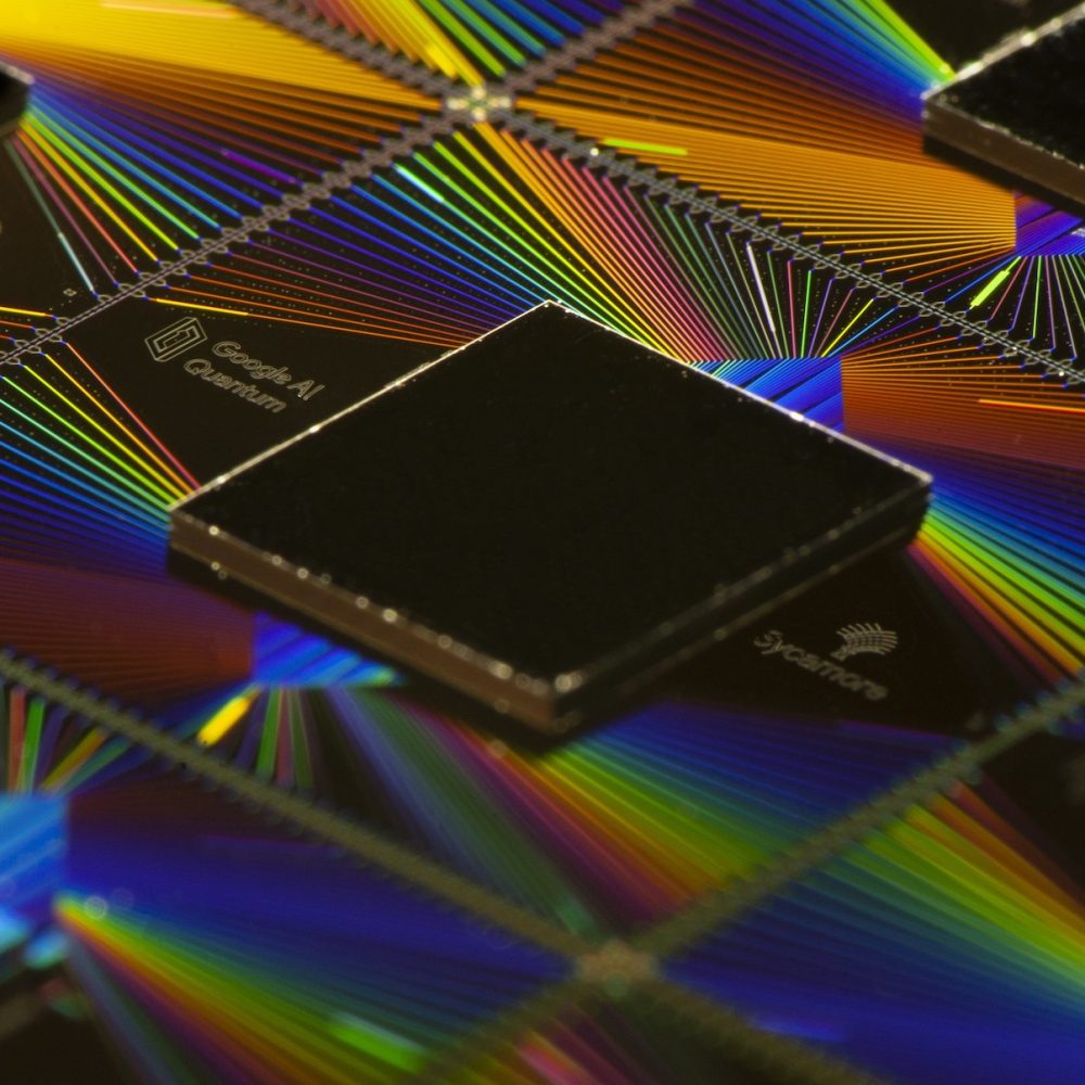 Image of a chip above iridescent wiring.