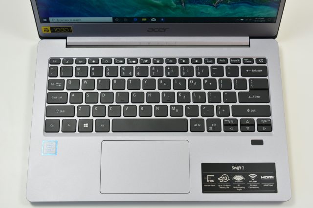 The Acer Swift 3 laptop on a white table.