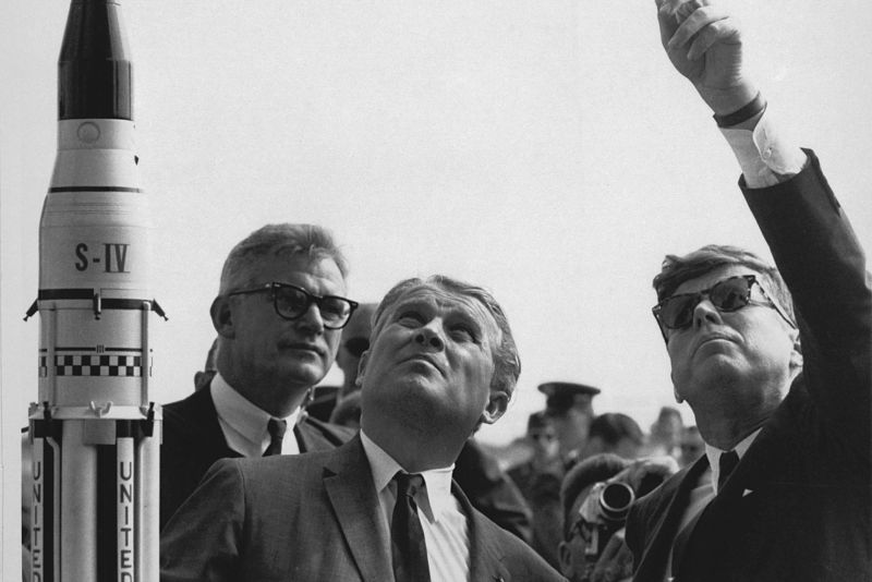  L-R: NASA Deputy Administrator Robert Seamans, Marshall Space Flight Center Director Wernher von Braun, and President John F. Kennedy.