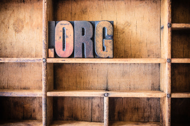 The word DOT ORG written in vintage wooden letterpress type in a wooden type drawer.