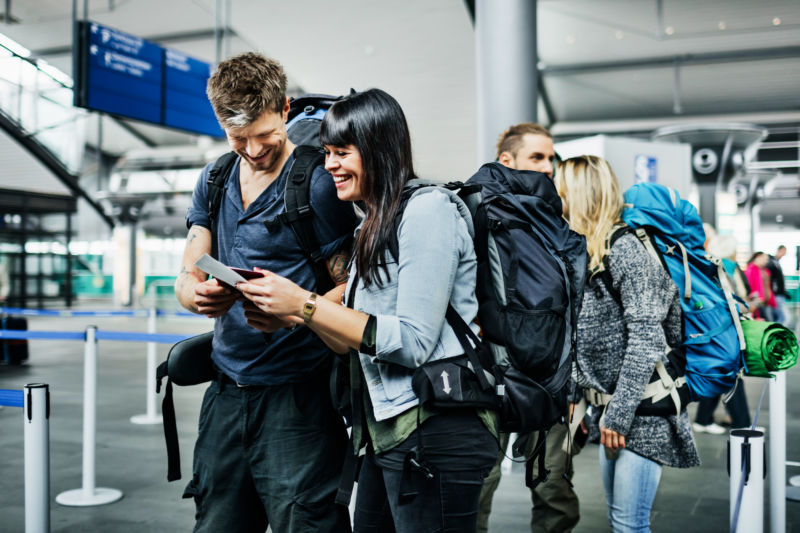 Not all of us frequently travel with camping/hiking backpacks like these joyful stock photo travelers—luckily, we have some recommendations on tech tailored for on-the-go life. 