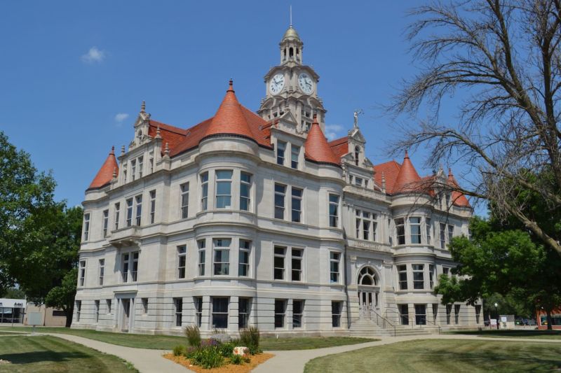 Three-story courthouse with corner gables.