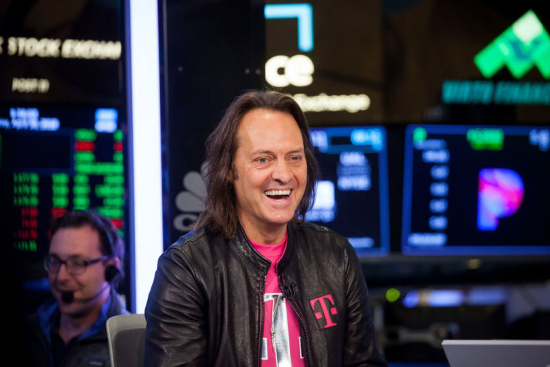 T-Mobile CEO John Legere smiling during an interview at the New York Stock Exchange.