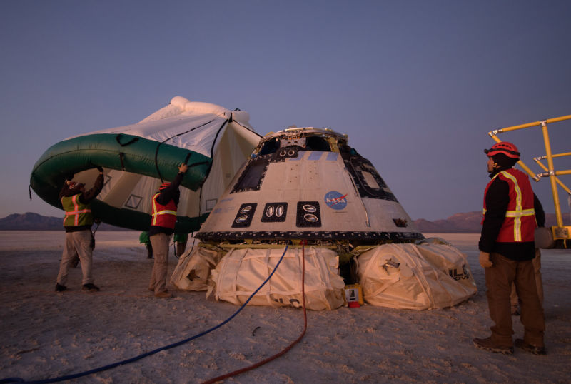 A protective tent is placed over Starliner after it returned to Earth in December.