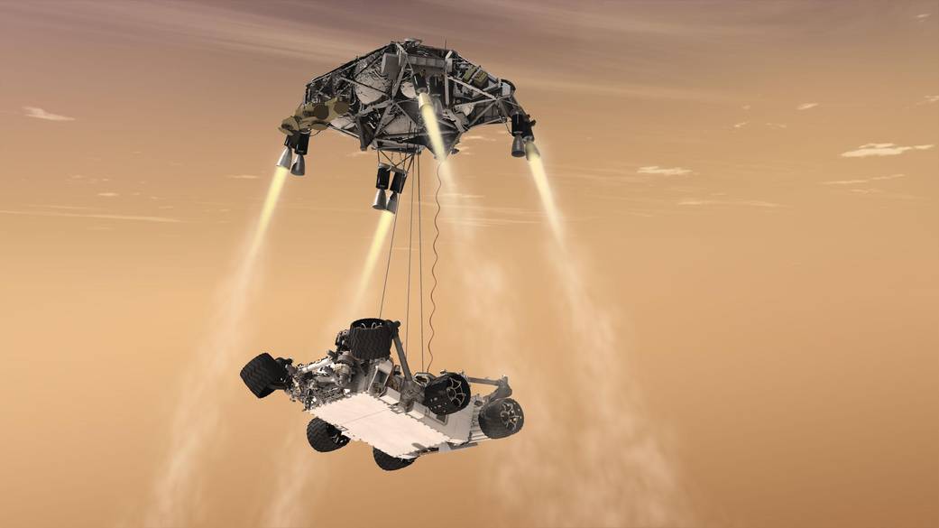 An artist's concept shows the sky crane maneuver during the descent of NASA's Curiosity rover to the Martian surface.