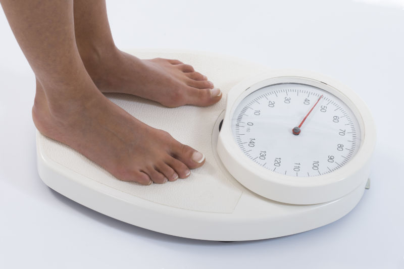 Woman on a kg weight scale 