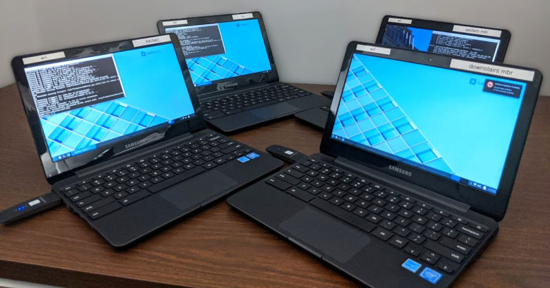 Behold the glory: four refurbished Chromebooks, each with an additional Linksys WUSB6300 Wi-Fi adapter for out-of-band control and communications.