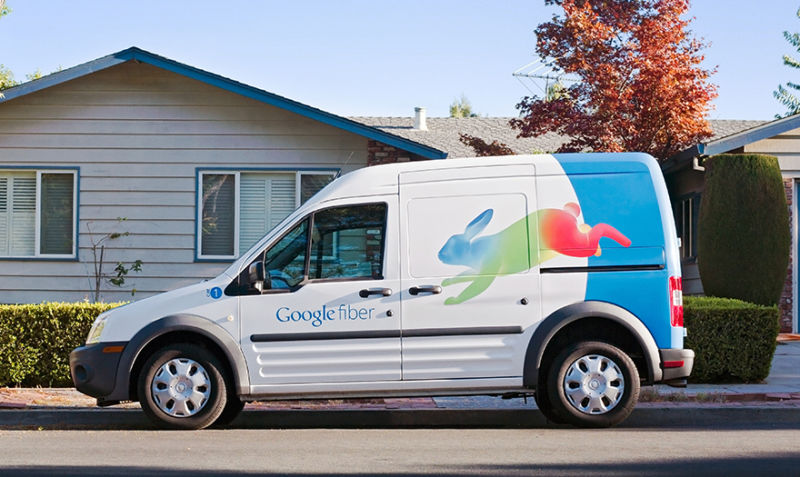 A Google Fiber van parked in front of a house.