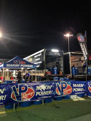 A truck and tents with VP racing banners