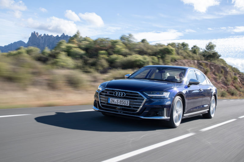 Promotional image of an Audi on a country highway.