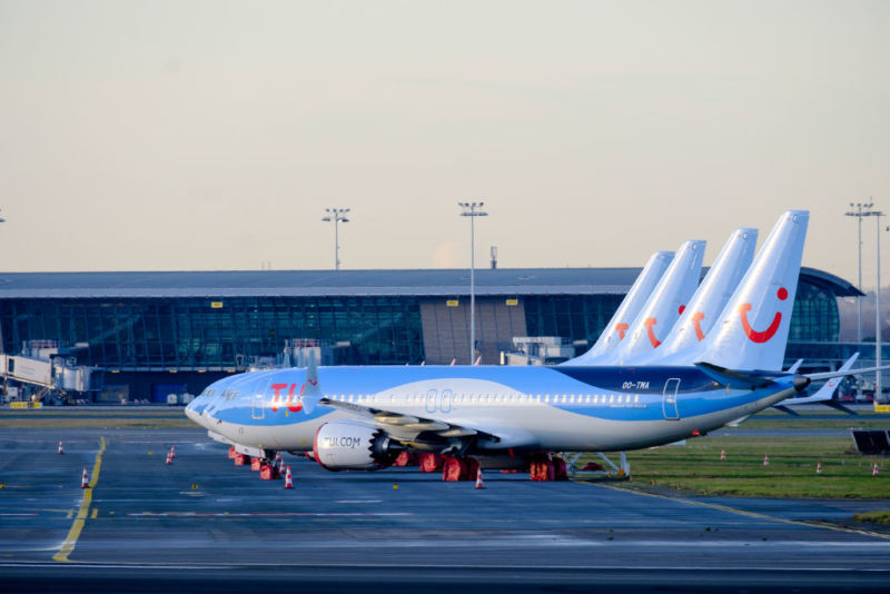 Four Boeing 737 MAX from TUI fly Belgium sit parked in Brussels on December 18, 2019. Boeing now says these planes, as well as all others they sold and the approximately 400 airplanes in storage, won't fly again until at least June or July.