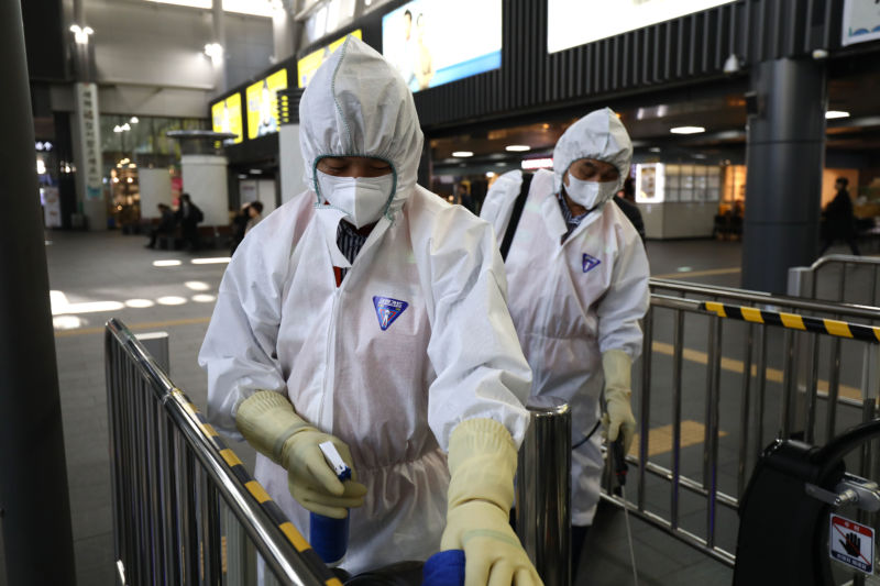 SEOUL, SOUTH KOREA - JANUARY 24: Disinfection workers wearing protective gear spray anti-septic solution in a train terminal amid rising public concerns over the spread of China's Wuhan Coronavirus at SRT train station on January 24, 2020 in Seoul, South Korea. 