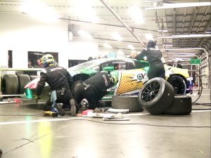 A pop-art Lamborghini in the garage during the race.