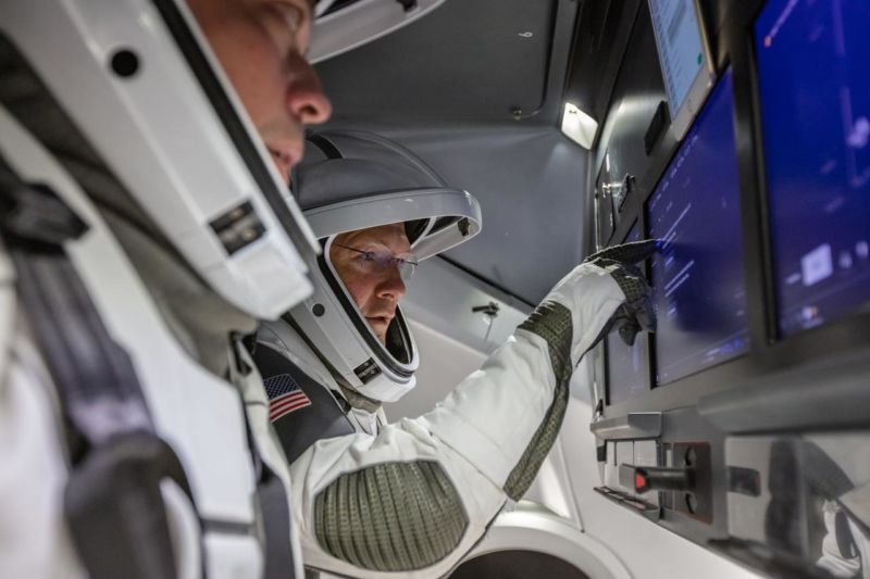 NASA astronauts Doug Hurley and Bob Behnken familiarize themselves with SpaceX’s Crew Dragon.