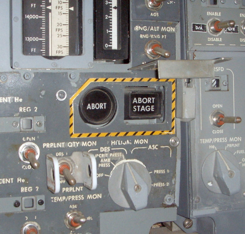 The source of all the trouble: the Abort pushbutton (along with its companion the Abort Stage pushbutton). This particular image is of the LM simulator currently residing at the <a href="https://www.cradleofaviation.org/">Cradle of Aviation Museum</a> in Long Island.