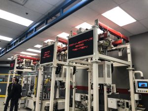 Three machines in an engine workshop