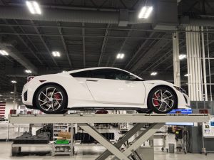A white NSX being inspected at the factory