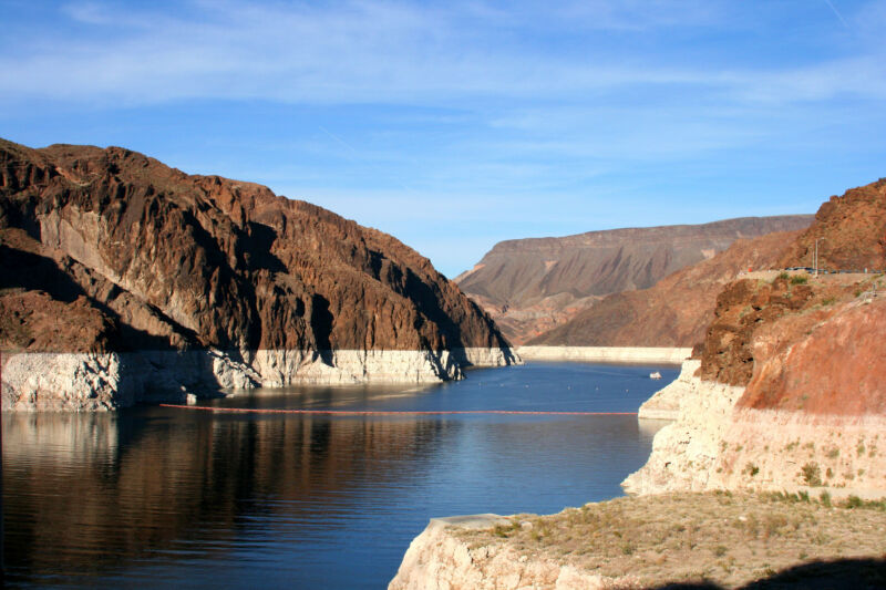 Lake surrounded by a rocky, arid landscape.