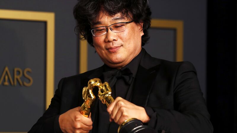 Three-time Oscar winner Bong Joon-ho makes his statuettes kiss. Legend.