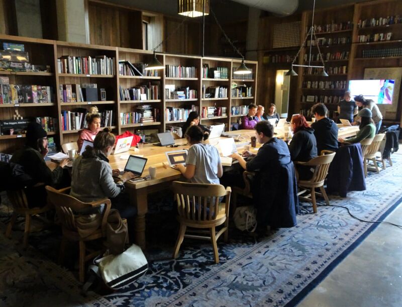 Kickstarter employees work at a library in the company's Brooklyn headquarters in 2017.