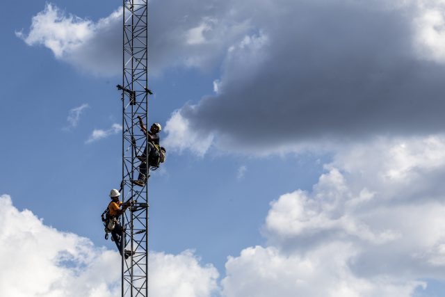 Verizon Communications Inc. workers install a temporary cell tower after Hurricane Florence hit in Newport, North Carolina, in September 2018. 