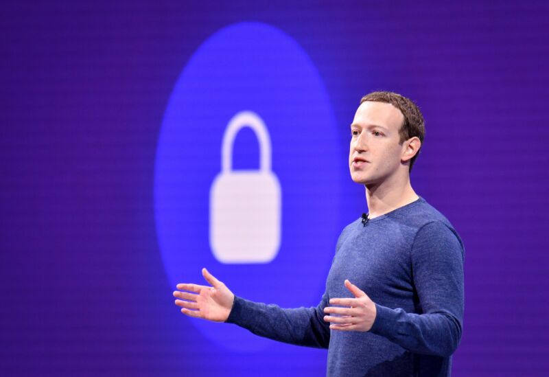 A casually dressed man speaks in front a stylized padlock symbol.