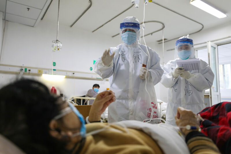 WUHAN, CHINA - FEBRUARY 13 2020: Medical personnel check the conditions of patients in Jinyintan Hospital, designated for critical COVID-19 patients, in Wuhan in central China's Hubei province Thursday, Feb. 13, 2020. 