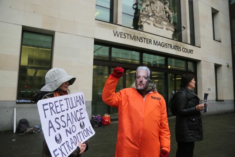 Street protesters dressed to look like Julian Assange.