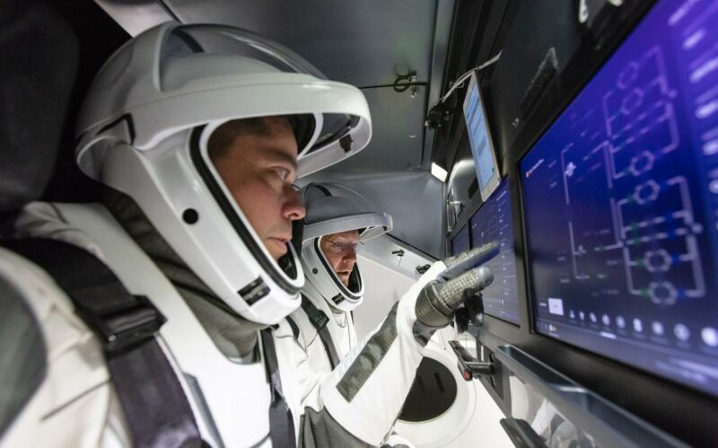 NASA astronauts Doug Hurley and Bob Behnken are introduced to SpaceX's Crew Dragon.