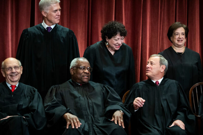 Six Supreme Court justices pose for an official group photo.