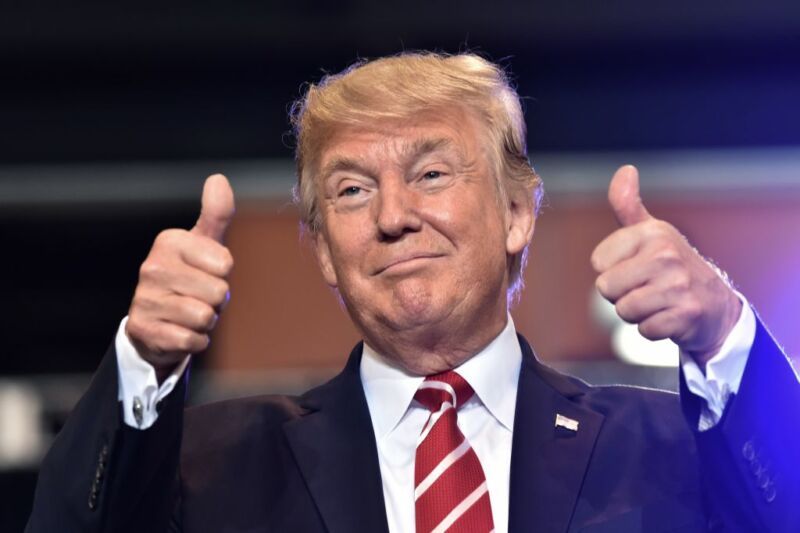 President Donald Trump giving the thumbs-up sign at a rally.