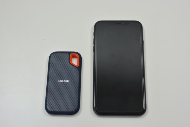 The SanDisk Extreme portable SSD next to an iPhone XR.